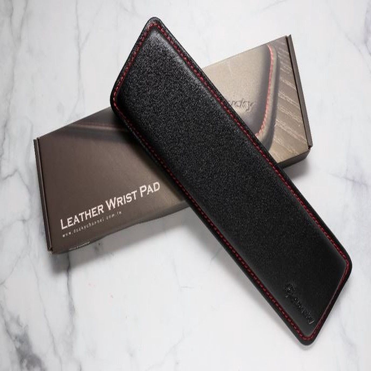 ducky-mini-leather-wrist-rest-with-red-stitching